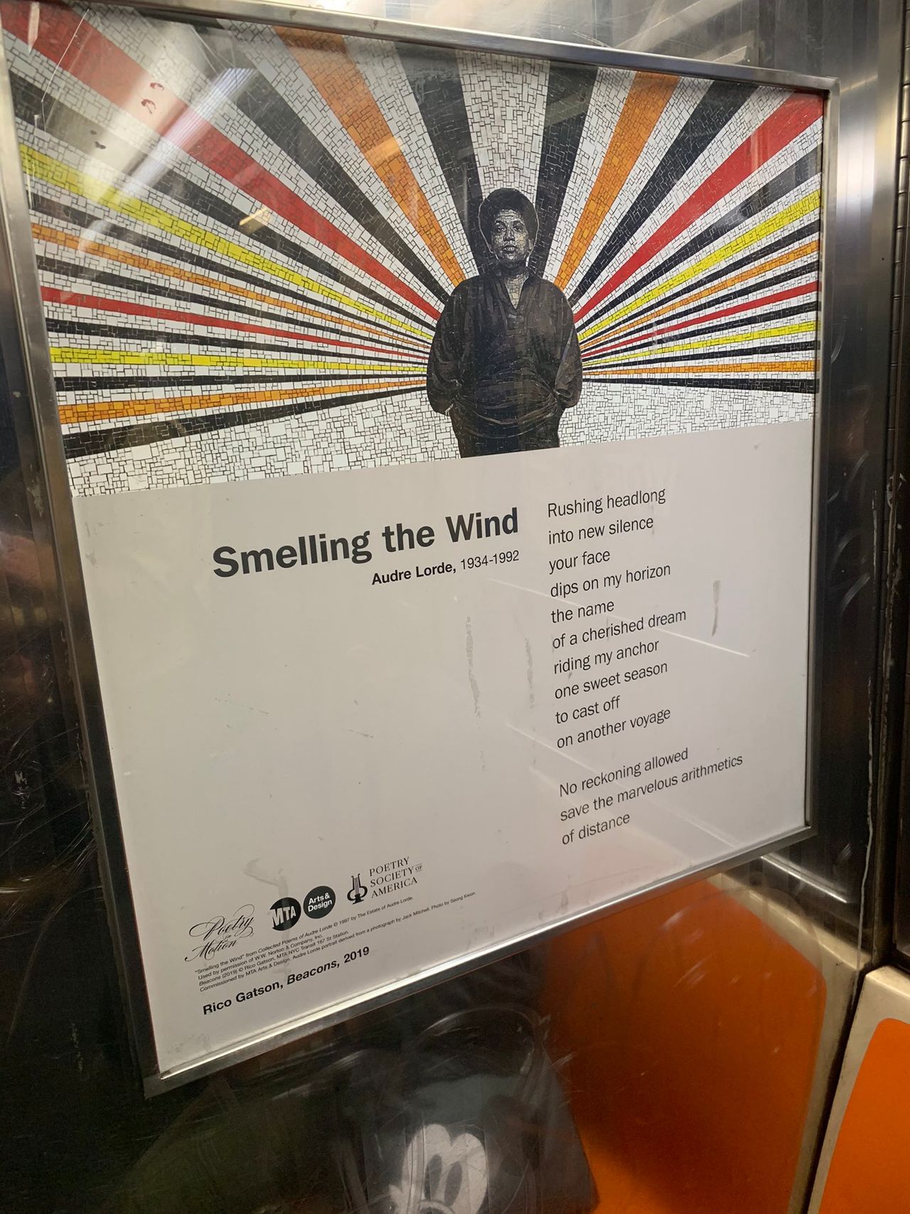 an Audre Lorde poem, 'Smelling the Wind' seen on the subway as part of the 'Poetry in Motion' series